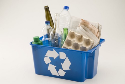 Waste removal trucks and collection bins on clean Wembley streets