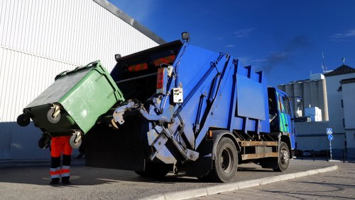 Company van and waste bins at a commercial site