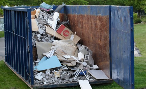 A professional team discussing house clearance plans in Wembley