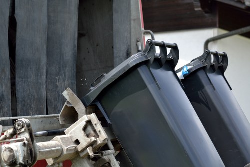 Waste management professionals handling materials in Wembley